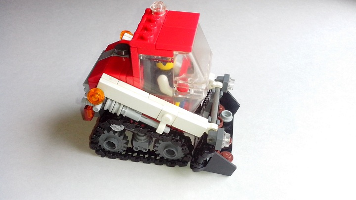 LEGO MOC - Battle of the Masters 'In cube' - Lego Bobcat: Ковш приводится в движение двумя пневматическими цилиндрами, расположенными над гусеницами